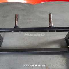 Muscle D Fitness Pro Strength Power Hack Squat machine with plate-loaded design, used in commercial gym settings.