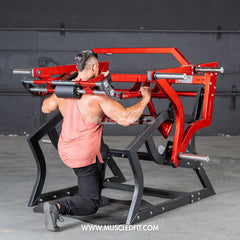 Plate loaded Pro Strength Power Hack Squat machine by Muscle D Fitness for commercial gyms, featuring adjustable safety bars and weight plates.
