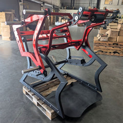 Muscle D Fitness Pro Strength Power Hack Squat plate-loaded gym machine with padded seat and weight plates for strength training.
