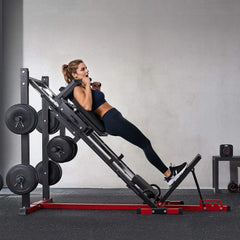 SAKSBY WHOLESALE Rovix 2000LBS adjustable leg press and hack squat machine for home gym workouts with woman using it.