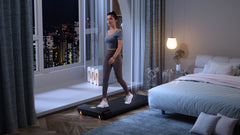 Foldable Kingsmith WalkingPad A1 Pro treadmill for under desk use, shown folded and unfolded on a clean surface.