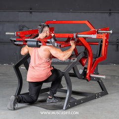 Muscle D Fitness Pro Strength Power Hack Squat plate-loaded gym machine with padded backrest and weight plates for strength training.