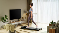 Foldable Kingsmith WalkingPad A1 Pro treadmill for under desk walking, showing the compact design and black finish.