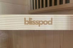 Zoppinh Blisspod Vienna Far Infrared Sauna with wooden interior and adjustable seating for relaxing infrared therapy sessions.