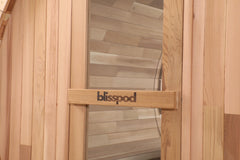 Zoppinh Blisspod Prague outdoor steam barrel sauna with Canadian Red Cedar wood, showcasing the round sauna structure and wooden exterior.
