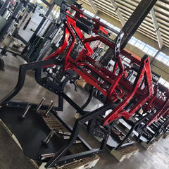 Muscle D Fitness Pro Strength Power Hack Squat machine with plate-loaded design for commercial gym use, showing the squat guide and weight plates.