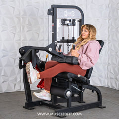 Muscle D Fitness Classic V2 selectorized leg extension and seated leg curl combo machine with padded seats and adjustable settings.