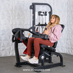 Muscle D Fitness Classic V2 selectorized leg extension and seated leg curl combo machine with padded seat and adjustable weights.