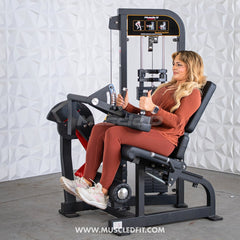 Muscle D Fitness Classic V2 selectorized seated leg curl machine with padded seat and adjustable leg pad for targeted hamstring exercises.