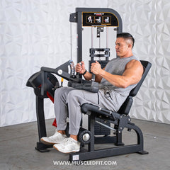 Muscle D Fitness Classic V2 seated leg curl machine with padded seat and adjustable leg pad for strength training.