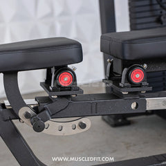 Muscle D Fitness Classic V2 selectorized multi-press machine for chest and shoulder workouts with padded seats and adjustable handles.