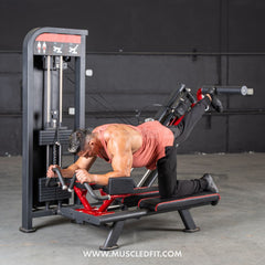 Muscle D Fitness Classic V2 Selectorized Glute Kick Machine for strengthening glutes in a commercial gym setting.