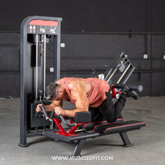Muscle D Fitness Classic V2 Selectorized Glute Kick Machine for targeted glute and thigh workouts in a commercial gym setting.
