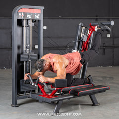 Muscle D Fitness Classic V2 Selectorized Glute Kick Machine for effective glute muscle toning in commercial gyms.
