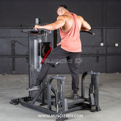 Muscle D Classic V2 Selectorized Multi-Hip Machine for glutes and hips, with adjustable seat and handle grips in a gym setting.