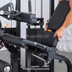 Muscle D Fitness Classic V2 selectorized seated leg curl machine with padded seat and adjustable leg pad for hamstring workouts.