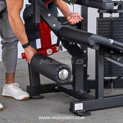 Muscle D Fitness Classic V2 Selectorized Seated Leg Curl Machine with padded seat and adjustable leg pad for targeting hamstrings.