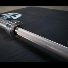 7' Stainless Steel Olympic Bar - Bushing by Muscle D Fitness