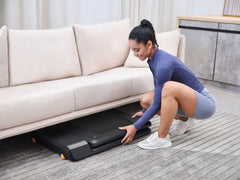 Foldable KingSmith WalkingPad A1 Pro treadmill for under desk use, shown in compact, folded position with control panel visible.