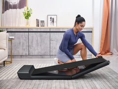 Foldable Kingsmith WalkingPad A1 Pro under-desk treadmill, compact design with digital display and safety features.