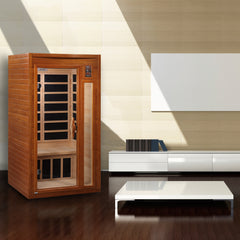 Golden Designs Inc. 1-2 person low EMF far infrared sauna, compact and sleek design with glass door and wooden interior.