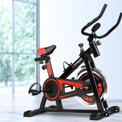 Black Trustymall exercise bike with a flywheel, designed for home and gym workouts, featuring adjustable seat and handlebars.