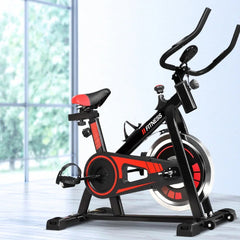 Black Trustymall exercise spin bike with flywheel for home and gym workouts, featuring adjustable seat and handlebars.