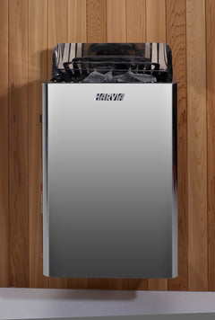 Golden Designs Sundsvall traditional two-person sauna with Harvia wall-mounted stove inside, showcasing warm wooden interior and compact design.