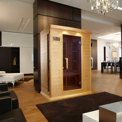 Golden Designs Inc. 2-person low EMF far infrared sauna with wood interior and glass front panel, designed for home relaxation.