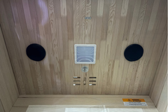 Zoppinh Finnmark FD-3 full spectrum infrared sauna with four-person capacity, shown with wooden interior and digital control panel.