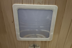 Finnmark FD-3 full spectrum infrared sauna by Zoppinh with space for four people, featuring wooden interior and control panel.