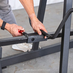 Muscle D Fitness Excel T-Bar Row machine, plate-loaded commercial gym equipment with sturdy metal frame and padded handles.