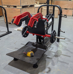 Muscle D Fitness Pro Strength Plate Loaded Hack Squat machine with padded support and weight plates for strength training.