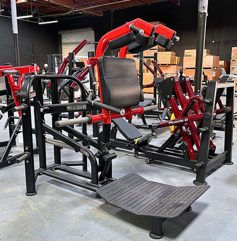 Muscle D Fitness Pro Strength Plate Loaded Hack Squat machine with padded backrest and weight plates for lower body workout.