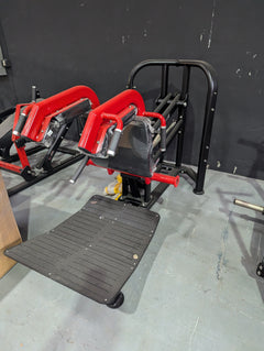 Muscle D Fitness Pro Strength Plate Loaded Hack Squat machine with padded backrest and weight plates ready for use.