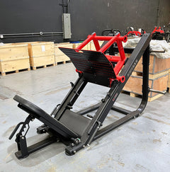Muscle D Fitness Pro Strength Heavy Duty Leg Press machine, plate loaded commercial gym equipment with padded seat and weight plates.