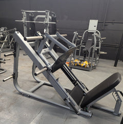 Muscle D Fitness Pro Strength Heavy Duty Plate Loaded Leg Press machine showing sturdy frame and weight plates for strength training.