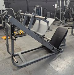 Muscle D Fitness Pro Strength Heavy Duty Plate Loaded Leg Press machine with sturdy frame and weight plates for strength training.