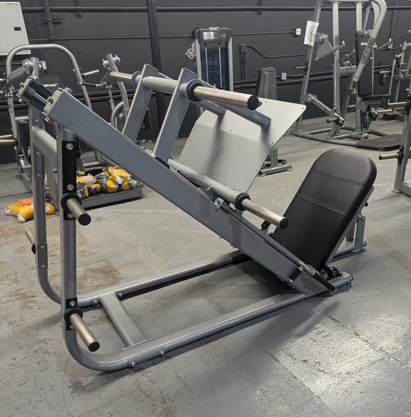 Muscle D Fitness Pro Strength Heavy Duty Plate Loaded Leg Press machine with sturdy frame and weight plates for strength training.