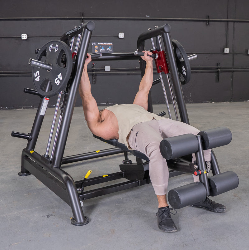 Muscle D Fitness Power Leverage V2 flat and decline convergent plate-loaded bench with padded seat and backrest for strength training.