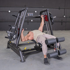 Muscle D Fitness Power Leverage V2 flat and decline convergent plate-loaded bench with padded seat and adjustable supports.