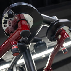 Muscle D Fitness Power Leverage V2 seated pec fly and rear delt combo, plate loaded with weight storage, in a gym setting.