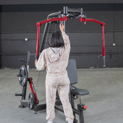Muscle D Fitness Power Leverage V2 seated pec fly and rear delt combo machine with weight storage and plate-loaded design.