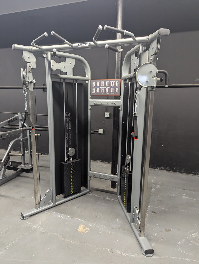Muscle D Fitness Sweet Dual Adjustable Pulley selectorized cable machine with adjustable handles and weight stack for strength training.
