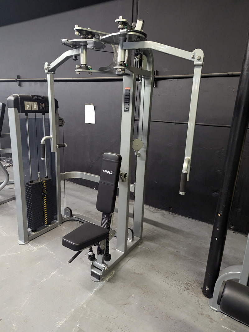Muscle D Fitness Sweet Selectorized Pec Deck and Rear Delt Combo machine showing padded seats and adjustable arm handles for strength training.