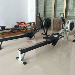 Foldable water rowing machine by 24 Hour Sport with adjustable seat and handles, designed for full-body workout and easy storage.