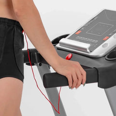 Space-saving 24 Hour Sport treadmill with pulse monitoring, featuring a compact design and digital display for home fitness.
