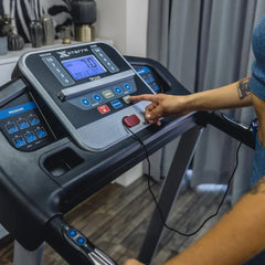Foldable 24 Hour Sport treadmill for home workouts, compact design with running belt and control panel, ideal for space-saving fitness.