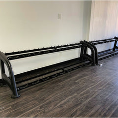 Muscle D Fitness Sweet 2-Tier Dumbbell Rack holding various dumbbells in a gym setting