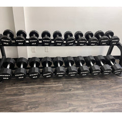 Muscle D Fitness Sweet Dumbbell Set with weights from 5 to 100 lbs, displayed on a rack, with black and silver dumbbells.